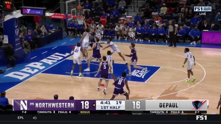Northwestern’s Boo Buie drives baseline for a reverse layup vs. DePaul
