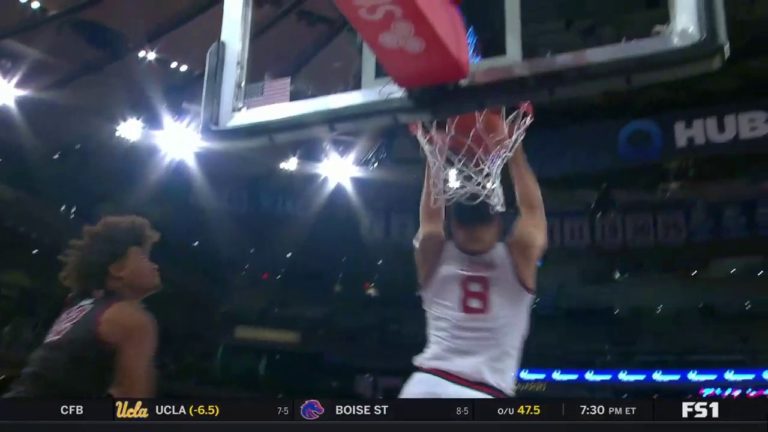 St. John’s Chris Ledlum throws down an acrobatic dunk against Fordham